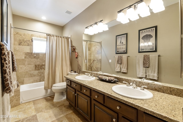 full bathroom featuring vanity, shower / bath combination with curtain, and toilet