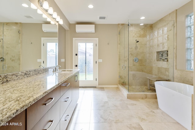 bathroom featuring tile patterned flooring, vanity, a wall unit AC, and independent shower and bath