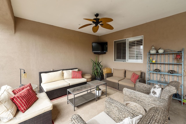 view of patio with an outdoor living space and ceiling fan