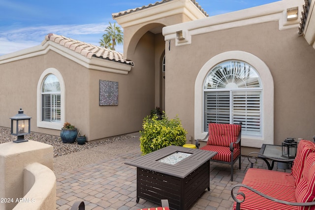 view of patio with an outdoor fire pit