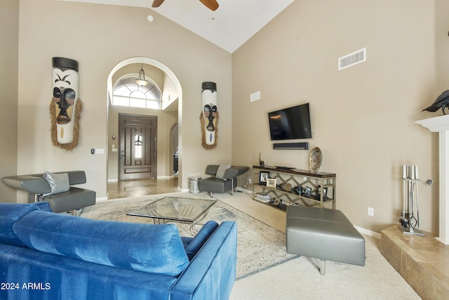 living room featuring high vaulted ceiling and ceiling fan