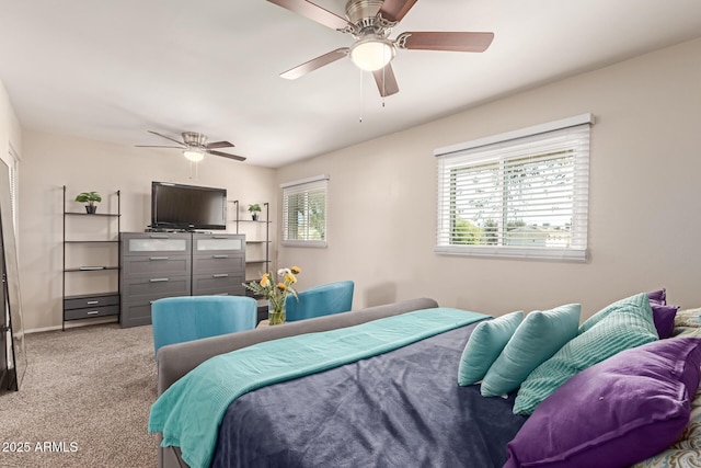 bedroom featuring baseboards, a ceiling fan, and light colored carpet