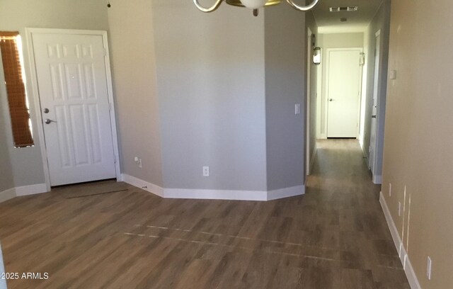 1827 E Carla Vista Dr, Gilbert, AZ 85295 - empty room featuring wood finished floors, baseboards, and a chandelier