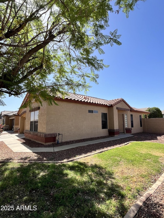 1827 E Carla Vista Dr, Gilbert, AZ 85295 - view of front of home with stucco siding, a tile roof, and driveway
