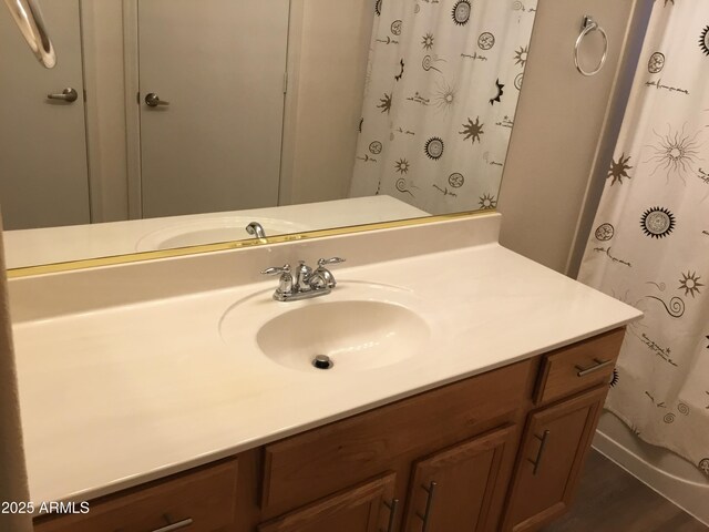 1827 E Carla Vista Dr, Gilbert, AZ 85295 - full bathroom with vanity, curtained shower, and wood finished floors