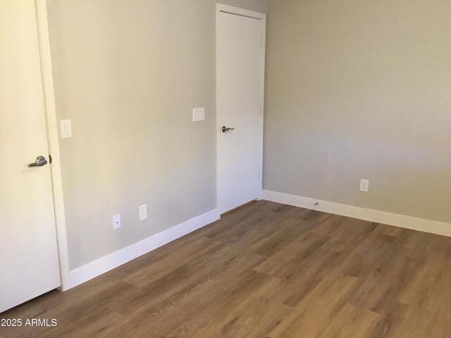 1827 E Carla Vista Dr, Gilbert, AZ 85295 - empty room with wood finished floors and baseboards