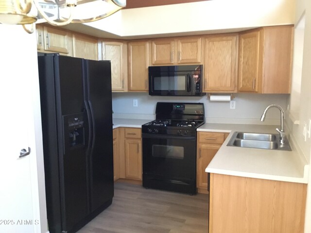 1827 E Carla Vista Dr, Gilbert, AZ 85295 - kitchen featuring black appliances, a sink, light countertops, and light wood-type flooring