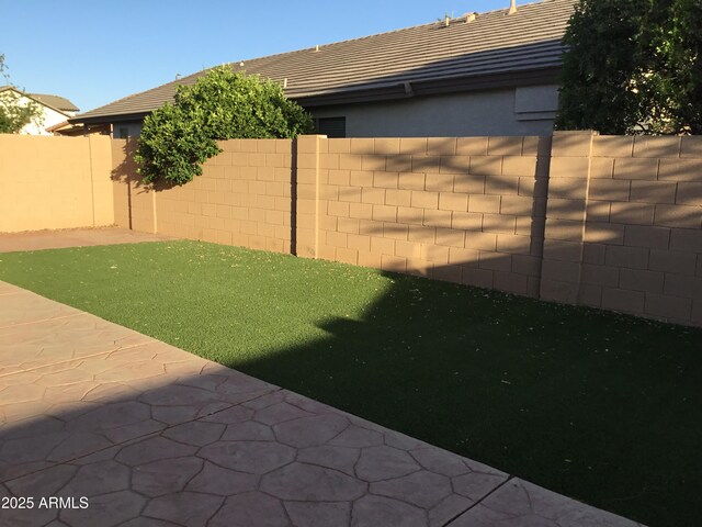 1827 E Carla Vista Dr, Gilbert, AZ 85295 - fenced backyard with a patio area