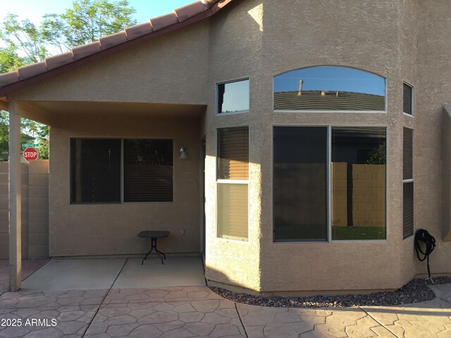 1827 E Carla Vista Dr, Gilbert, AZ 85295 - rear view of house with stucco siding and a patio
