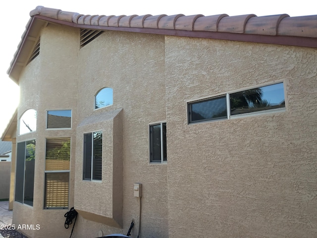 1827 E Carla Vista Dr, Gilbert, AZ 85295 - view of home's exterior featuring stucco siding and fence