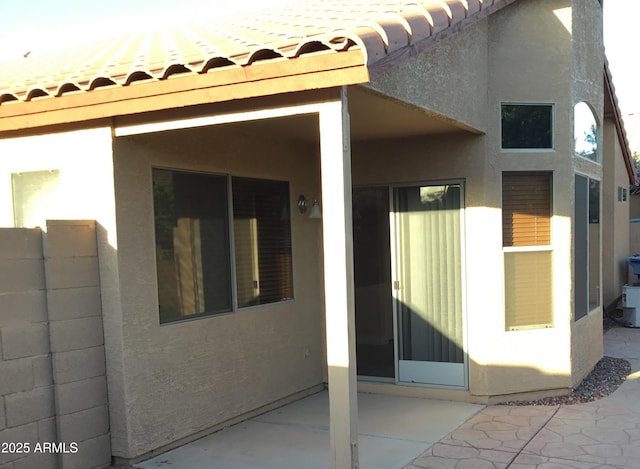 1827 E Carla Vista Dr, Gilbert, AZ 85295 - property entrance with stucco siding, a patio, and a tile roof