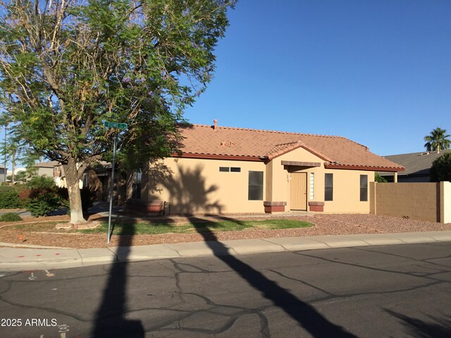 1827 E Carla Vista Dr, Gilbert, AZ 85295 - view of front of house with a tile roof, stucco siding, and fence