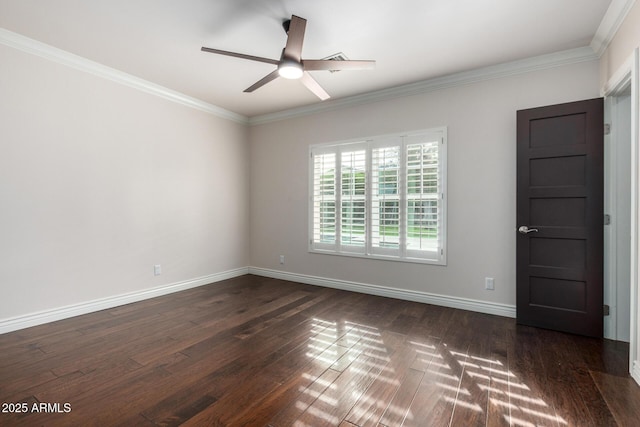 spare room with ceiling fan, crown molding, and dark wood-type flooring