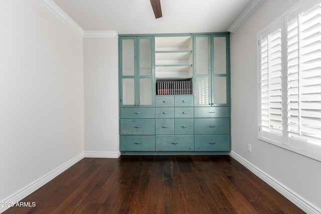 unfurnished bedroom featuring ceiling fan, dark hardwood / wood-style flooring, and crown molding