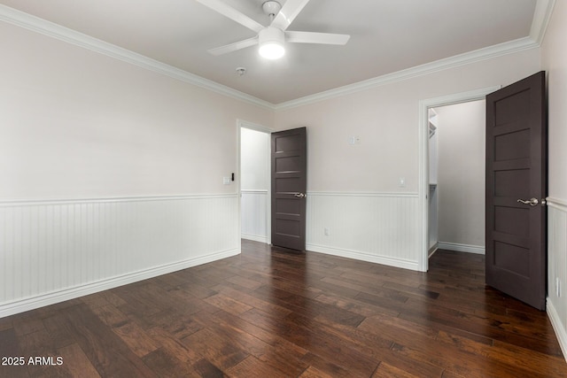 unfurnished bedroom with ceiling fan, crown molding, and dark hardwood / wood-style floors