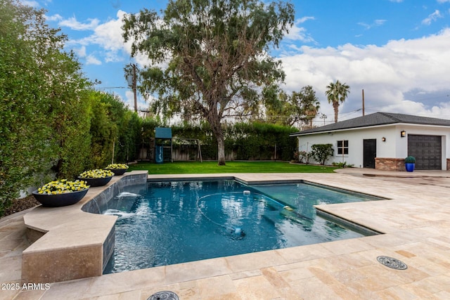 view of swimming pool featuring pool water feature, a patio area, a playground, and a lawn