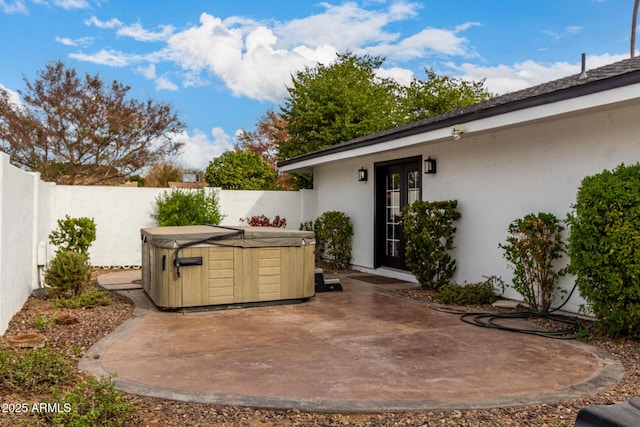 view of patio / terrace featuring a hot tub