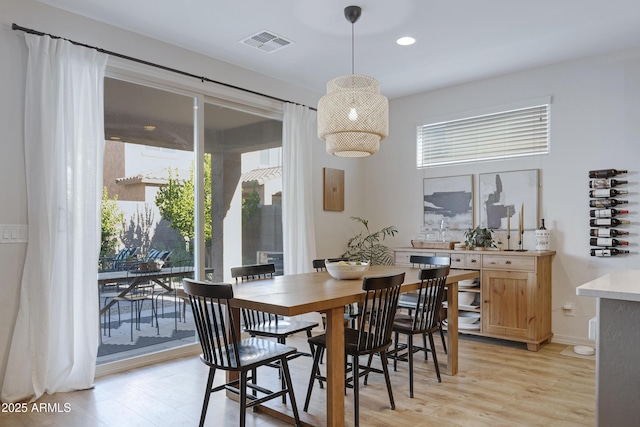 dining room featuring light wood-type flooring, visible vents, and recessed lighting