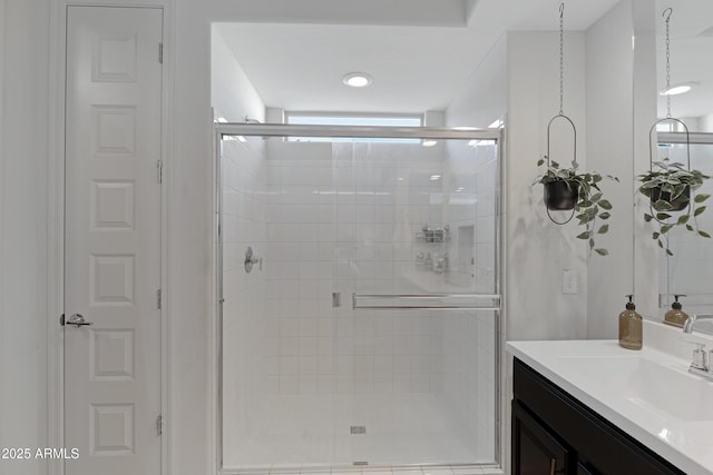 full bath featuring vanity and a stall shower