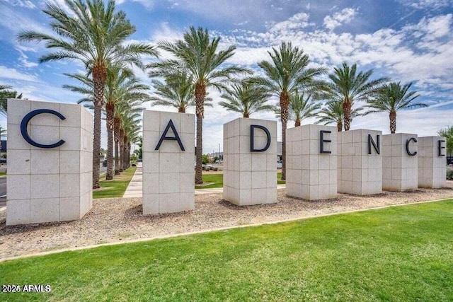 community / neighborhood sign with a lawn