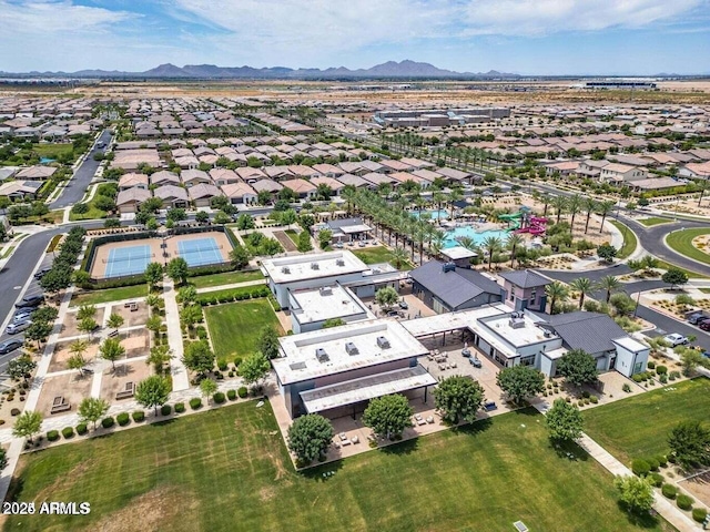 birds eye view of property with a mountain view and a residential view