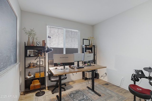 office with baseboards and wood finished floors