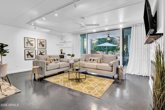 living room with track lighting and ceiling fan