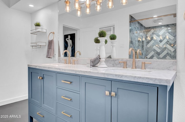 bathroom with a shower with door and vanity