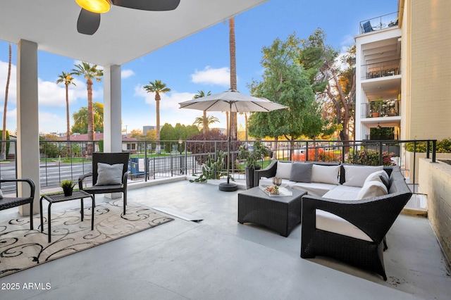 view of patio featuring ceiling fan and an outdoor living space