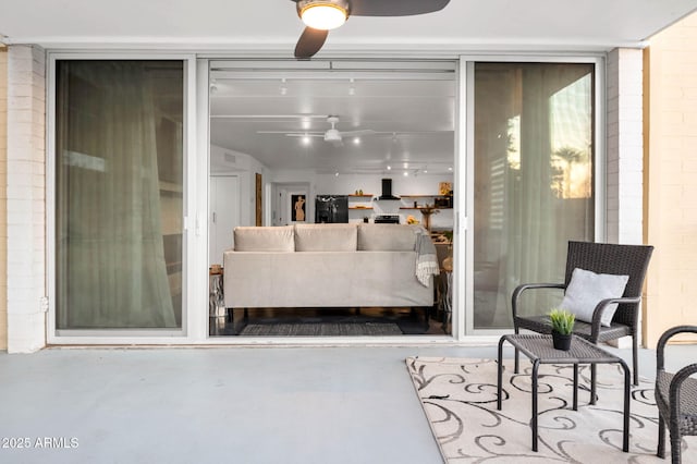 interior space featuring ceiling fan