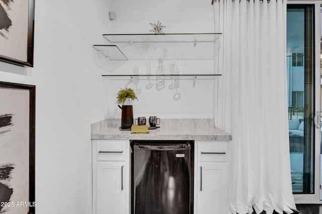 bar featuring white cabinets