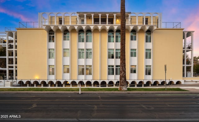 view of outdoor building at dusk