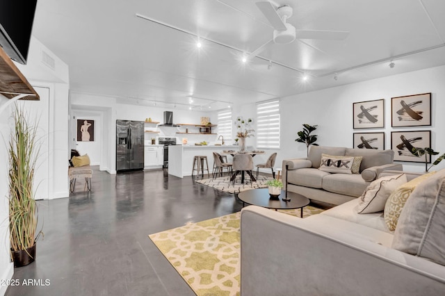 living room featuring ceiling fan