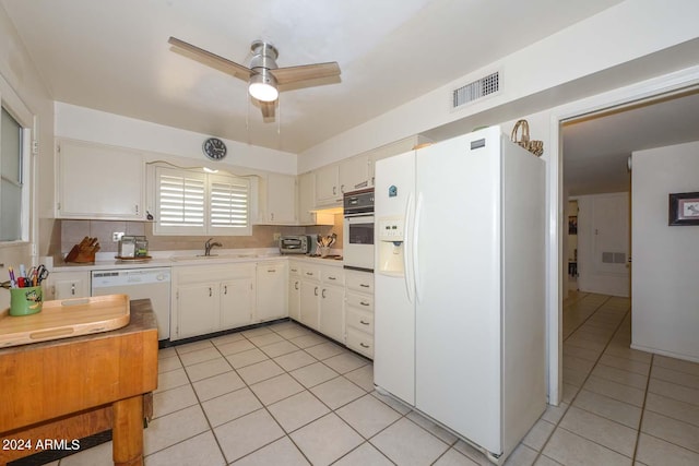 kitchen with light tile floors, ceiling fan, tasteful backsplash, white appliances, and sink