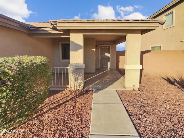 entrance to property with a patio area