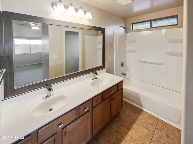 bathroom with tile patterned floors, ceiling fan, shower / washtub combination, and vanity