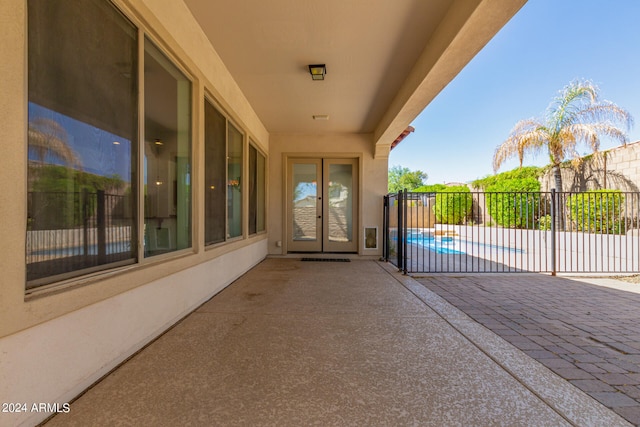 view of patio / terrace with a fenced in pool