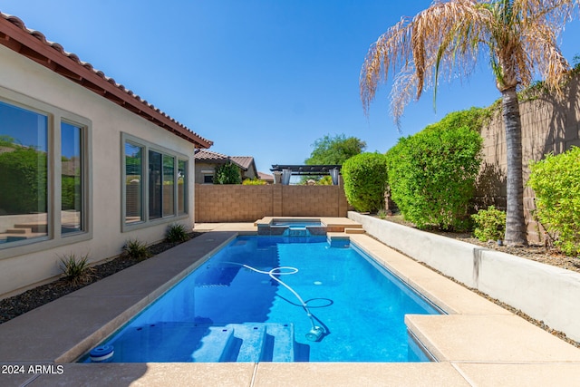 view of pool featuring an in ground hot tub and a patio area