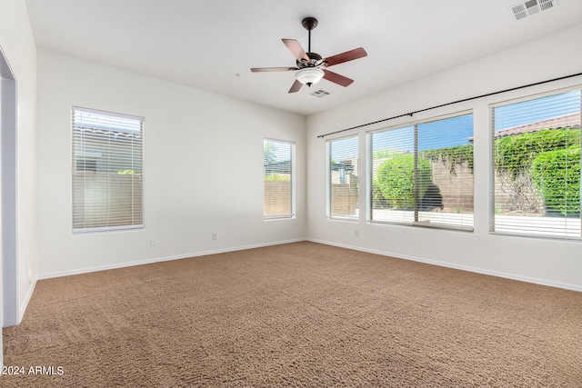 carpeted empty room with ceiling fan