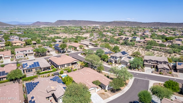 birds eye view of property with a mountain view