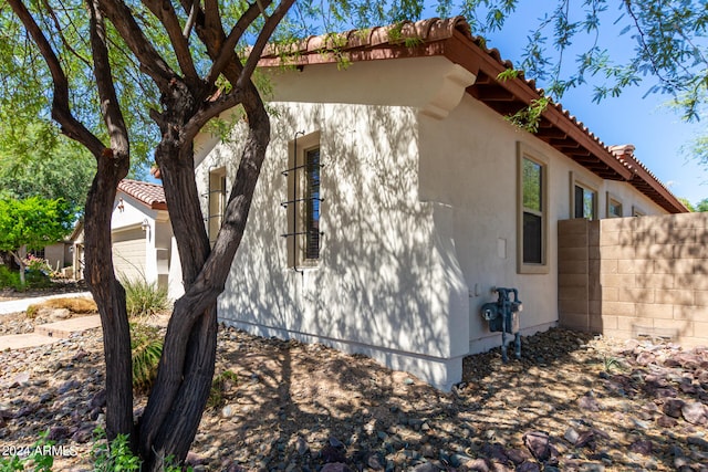 view of property exterior featuring a garage