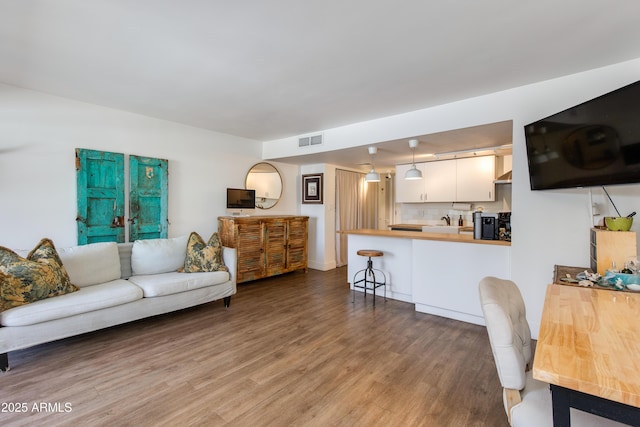 4727 E Lafayette Blvd Unit 211, Phoenix, AZ 85018 - living room with wood finished floors