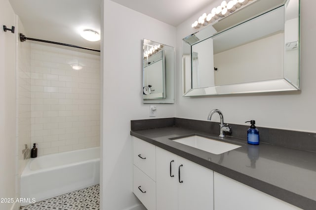 4727 E Lafayette Blvd Unit 211, Phoenix, AZ 85018 - bathroom featuring vanity,  shower combination, and tile patterned floors