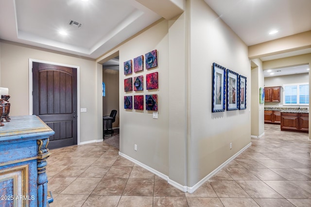 19414 W Pasadena Ave, Litchfield Park, AZ 85340 - hallway featuring light tile patterned floors, baseboards, and recessed lighting