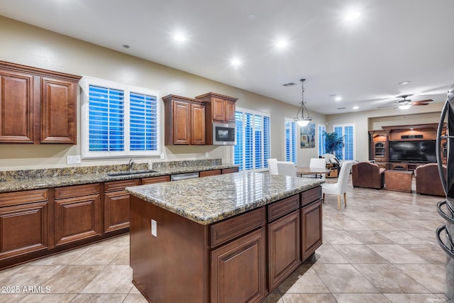 19414 W Pasadena Ave, Litchfield Park, AZ 85340 - kitchen with a sink, stainless steel appliances, a kitchen island, stone counters, and recessed lighting