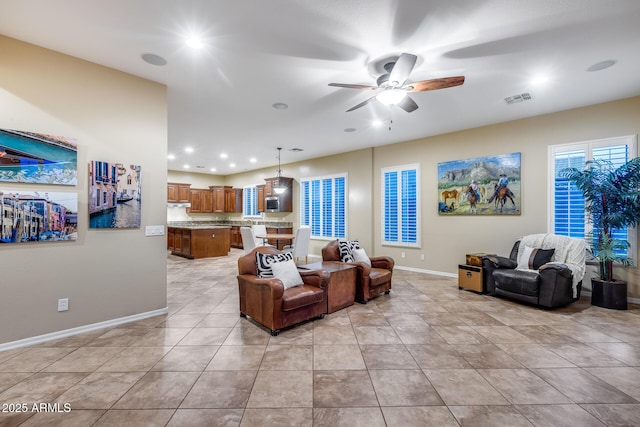 19414 W Pasadena Ave, Litchfield Park, AZ 85340 - living area with ceiling fan, baseboards, recessed lighting, and light tile patterned floors