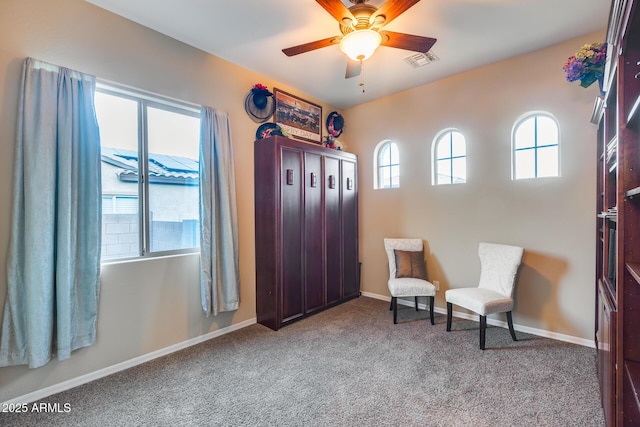 19414 W Pasadena Ave, Litchfield Park, AZ 85340 - living area featuring a ceiling fan, carpet floors, and baseboards