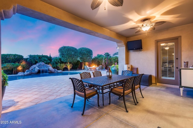 19414 W Pasadena Ave, Litchfield Park, AZ 85340 - view of patio / terrace featuring a ceiling fan, outdoor dining area, and an outdoor pool