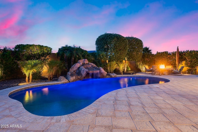 19414 W Pasadena Ave, Litchfield Park, AZ 85340 - outdoor pool featuring a fire pit and a patio area