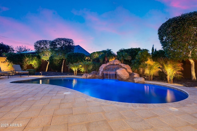 19414 W Pasadena Ave, Litchfield Park, AZ 85340 - pool at dusk with a patio and an outdoor pool